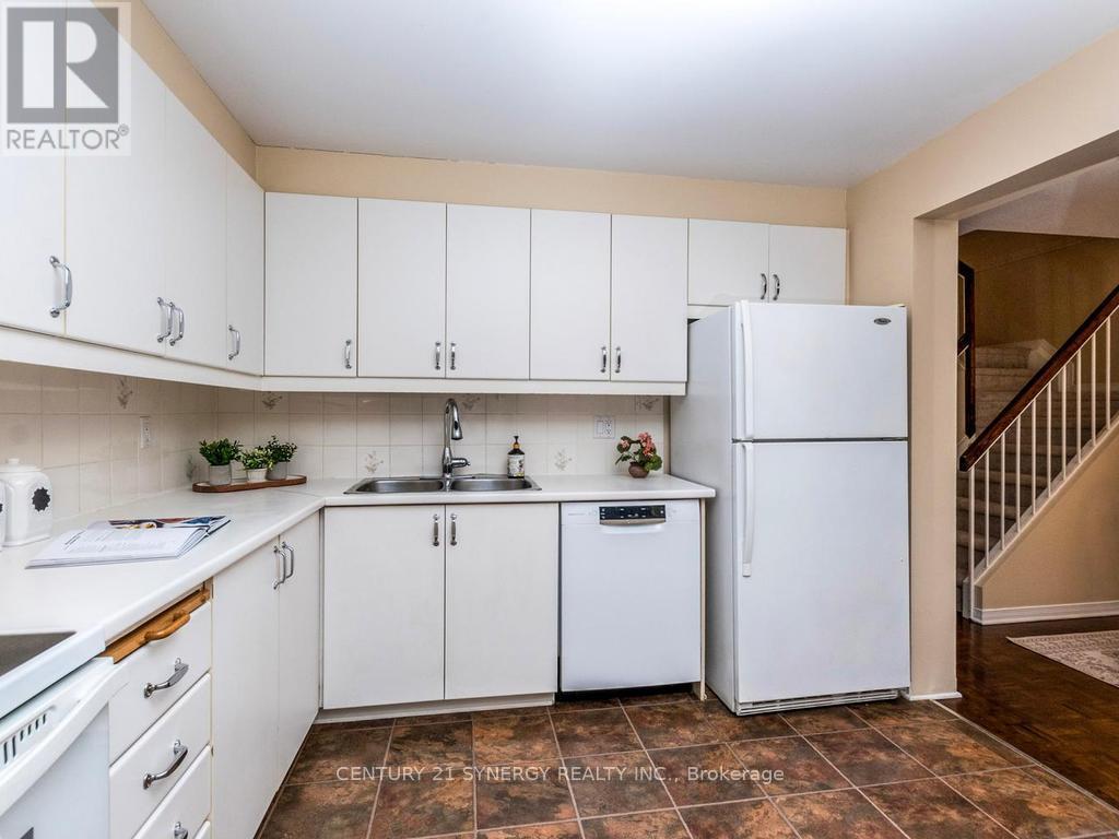 Kitchen with fridge,stove,dishwasher included. - 80 - 22C Maple Ridge Crescent, Ottawa, ON - Indoor Photo Showing Kitchen With Double Sink