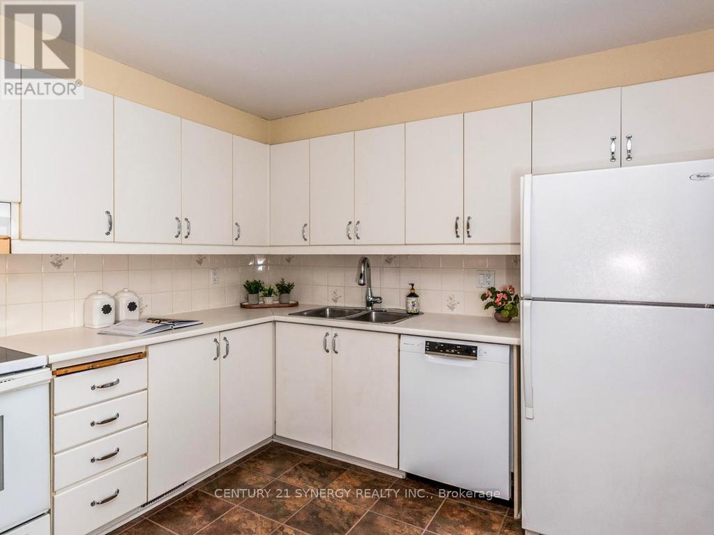 Kitchen with fridge,stove,dishwasher included. - 80 - 22C Maple Ridge Crescent, Ottawa, ON - Indoor Photo Showing Kitchen With Double Sink