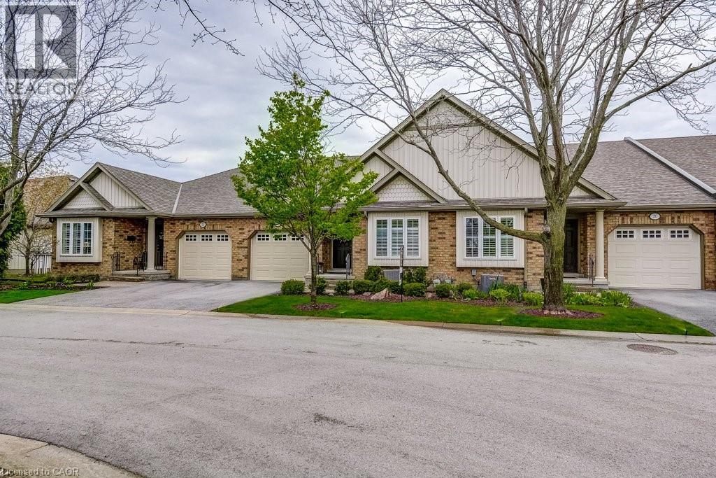 Brick exterior with light-colored siding accents and a pitched roof - 605 Welland Avenue Unit# 21, St. Catharines, ON - Outdoor With Facade