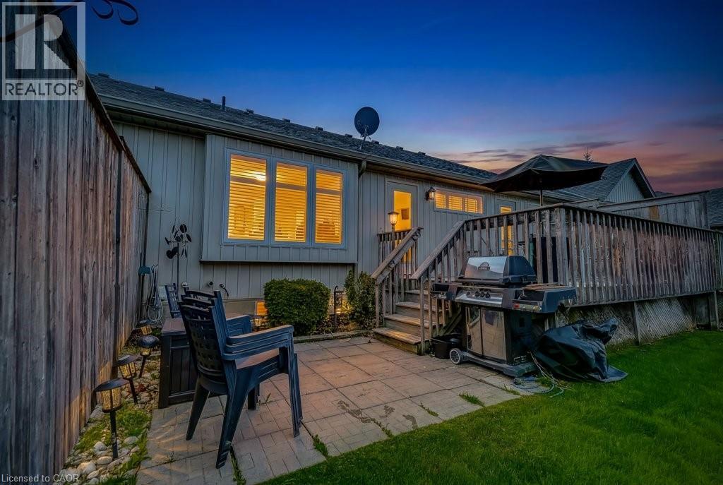 Rear exterior with wood siding and multi-pane windows - 605 Welland Avenue Unit# 21, St. Catharines, ON - Outdoor With Deck Patio Veranda