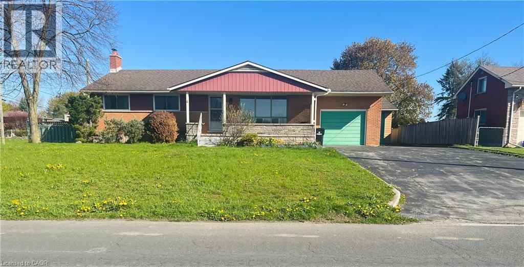 Brick exterior residence featuring a front porch with stone accents - 157 Schweitzer Street, Kitchener, ON - Outdoor