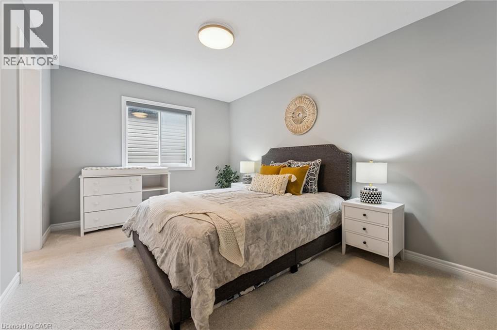 Bedroom featuring neutral carpeting and light gray walls - 628 Florencedale Crescent, Kitchener, ON