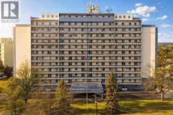 Multi-story residential building featuring numerous private balconies - 