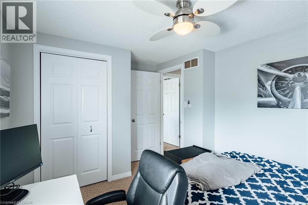 Neutral paint palette with textured carpeting - 560 Penny Lane, Waterloo, ON