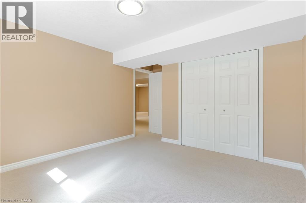 Light-colored wall-to-wall carpeting throughout - 227 Chestnut Hill Crescent, Kitchener, ON - Indoor Photo Showing Other Room