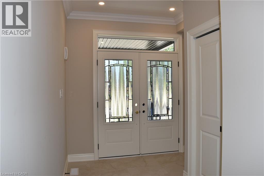 Entryway featuring double doors with decorative glass panels and a transom window - 8 Dunlop Road, Hamilton, ON - Indoor Photo Showing Other Room