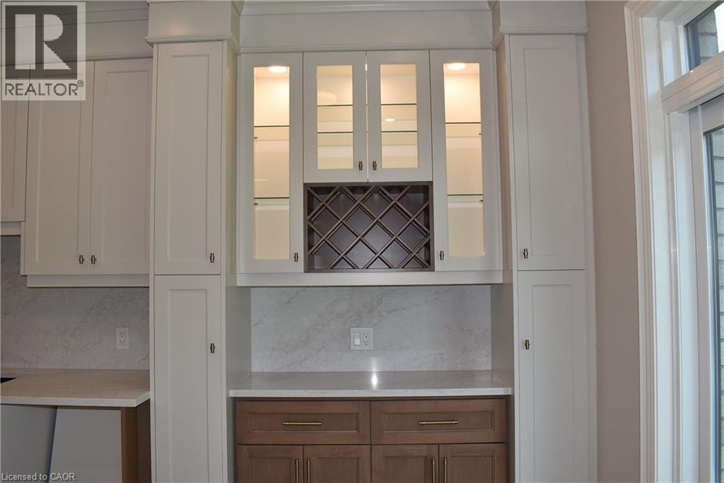 Servery area in dinette with wine rack and glass display cabinets. - 8 Dunlop Road, Hamilton, ON - Indoor