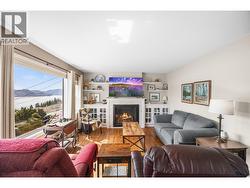 Living room with gas fireplace and lake and mountain views! -