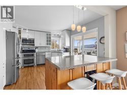 Updated kitchen - access to covered deck - lake and mountain views! -