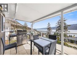 Spacious covered deck with beautiful lake and mountain views -
