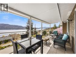 Spacious covered deck with beautiful lake and mountain views -