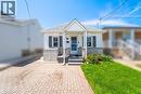 White siding exterior with stone veneer accents - 71 Beland Avenue N, Hamilton, ON 