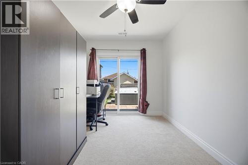Room with light-toned carpet flooring and white baseboards - 71 Beland Avenue N, Hamilton, ON 