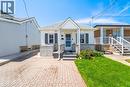 Charming bungalow with white siding and a stone facade - 71 Beland Avenue N, Hamilton, ON 