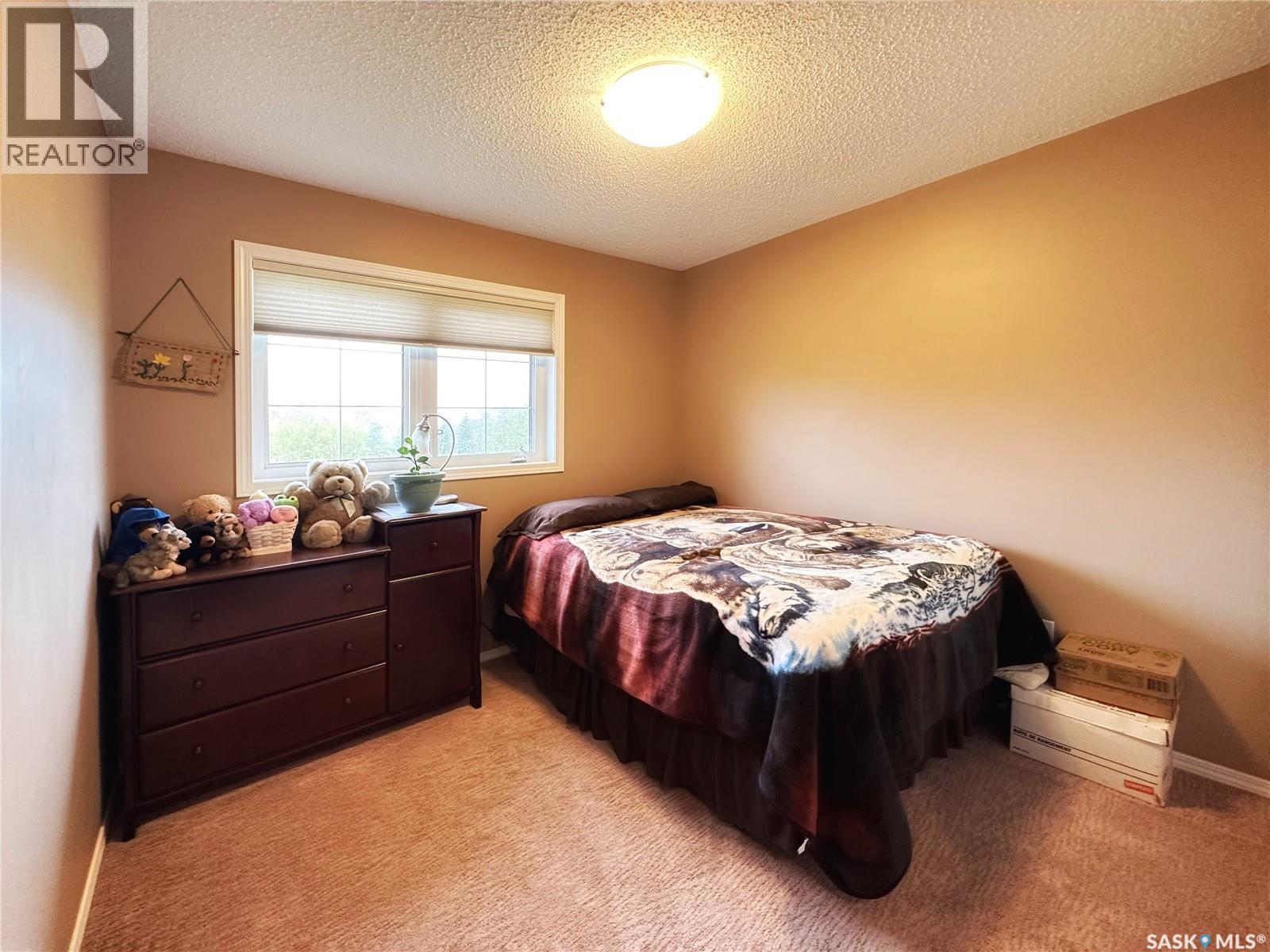 Bassingthwaite Acreage, Asquith, SK - Indoor Photo Showing Bedroom