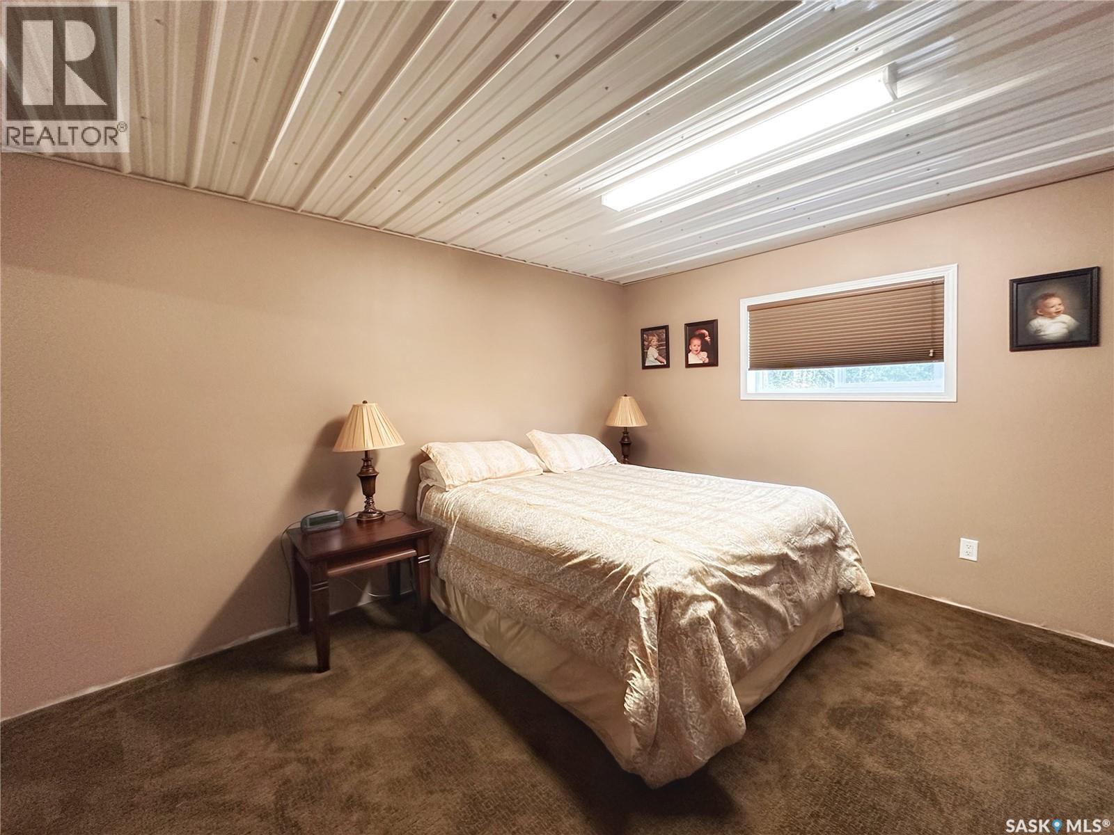 Bassingthwaite Acreage, Asquith, SK - Indoor Photo Showing Bedroom