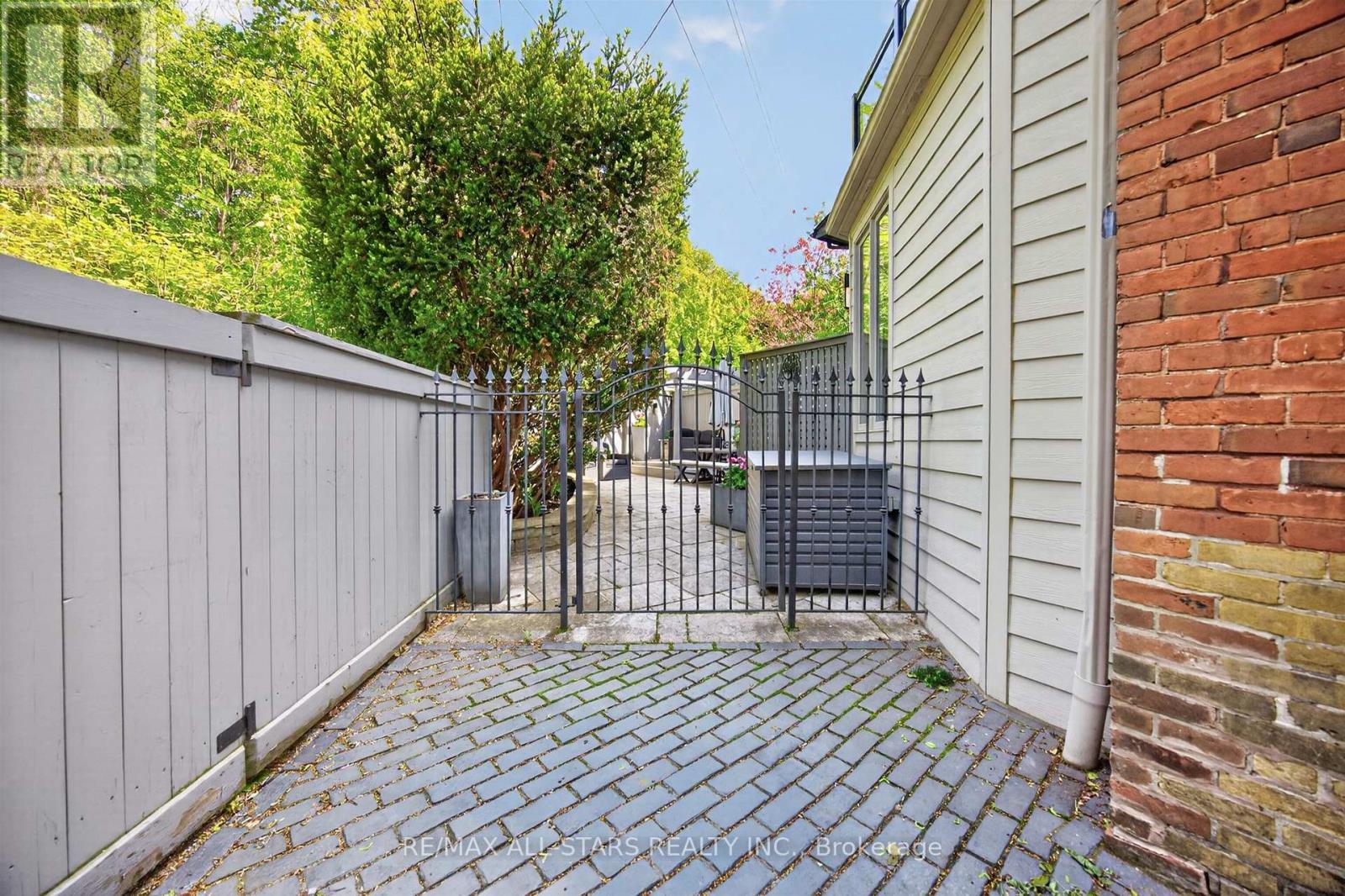 Wrought-Iron Gate Entrance to Yard - 30 Edgewood Crescent, Toronto, ON