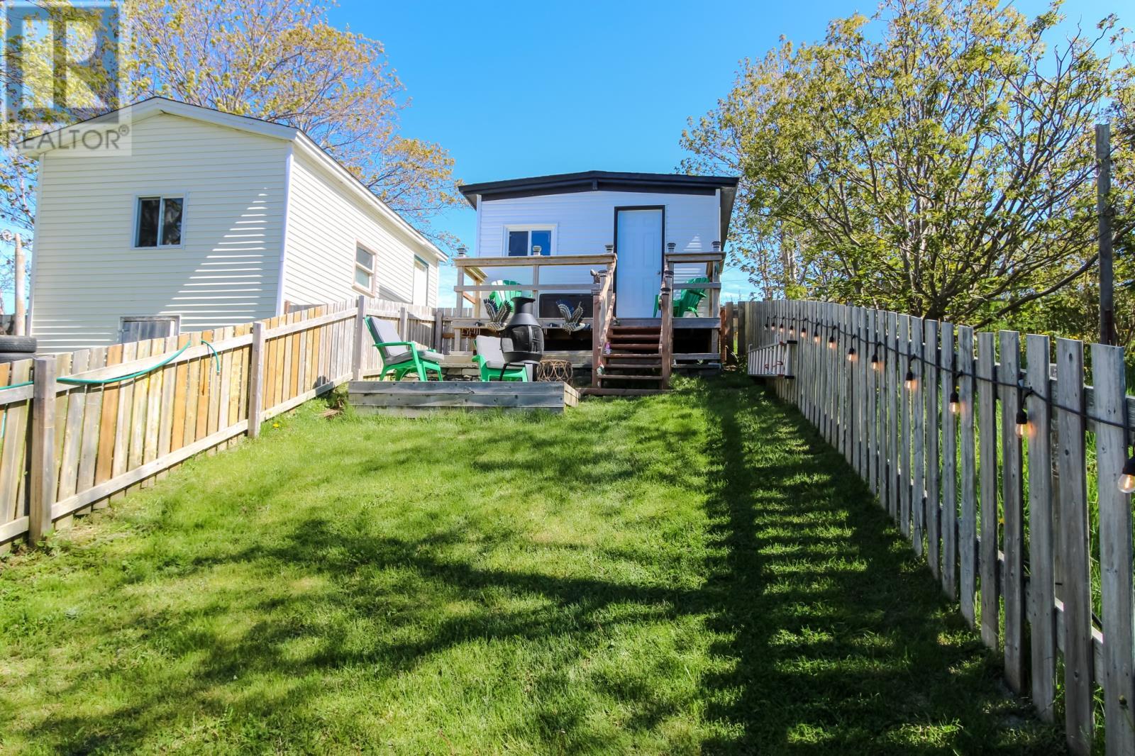 Fenced backyard with two sheds. - 92 Watson Crescent, St. John'S, NL