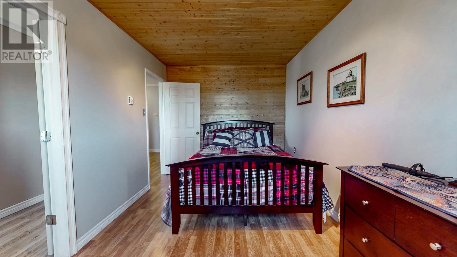 Bedroom at front of the house. Currently has a door connecting it to the 3rd bedroom to use it as a dressing room, but could be closed up to convert it back to use as a bedroom only. - 92 Watson Crescent, St. John'S, NL