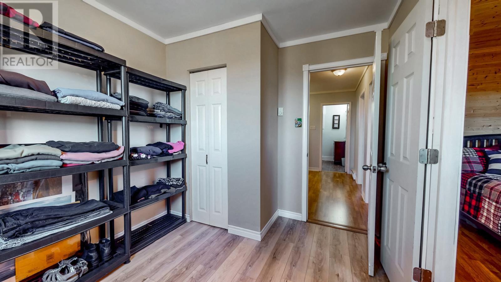 3rd bedroom accessible from both the hallway and the primary bedroom. - 92 Watson Crescent, St. John'S, NL