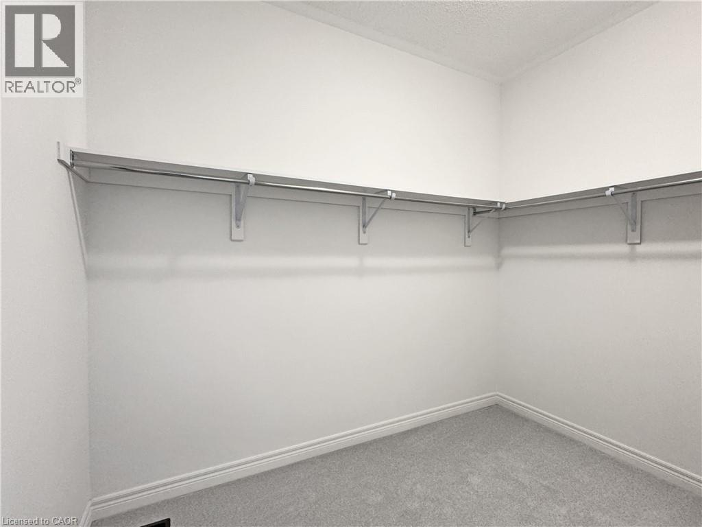 PRIMARY WALK-IN CLOSET - 82 Gledhill Crescent, Cambridge, ON - Indoor With Storage