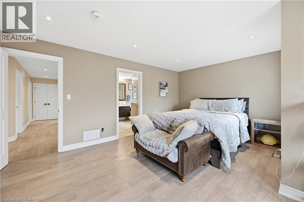 Spacious room featuring light wood-finish flooring, recessed lighting, and neutral wall paint - 1 Lindsay Way, Grimsby, ON - Indoor Photo Showing Bedroom