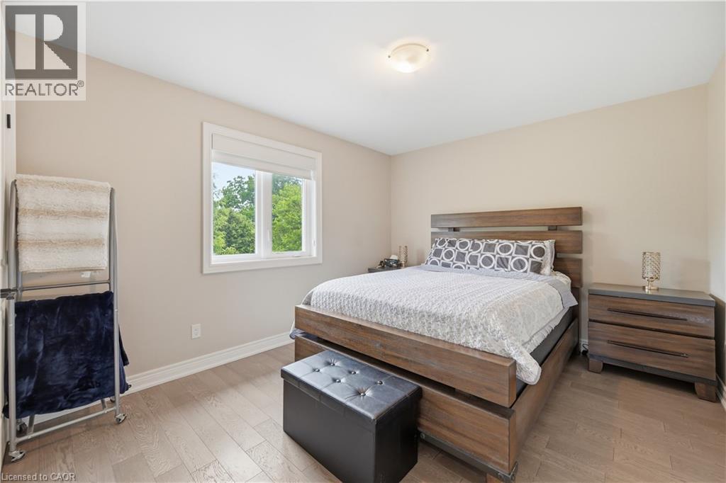 Bedroom featuring light wood-finish flooring and neutral wall tones - 1 Lindsay Way, Grimsby, ON - Indoor Photo Showing Bedroom