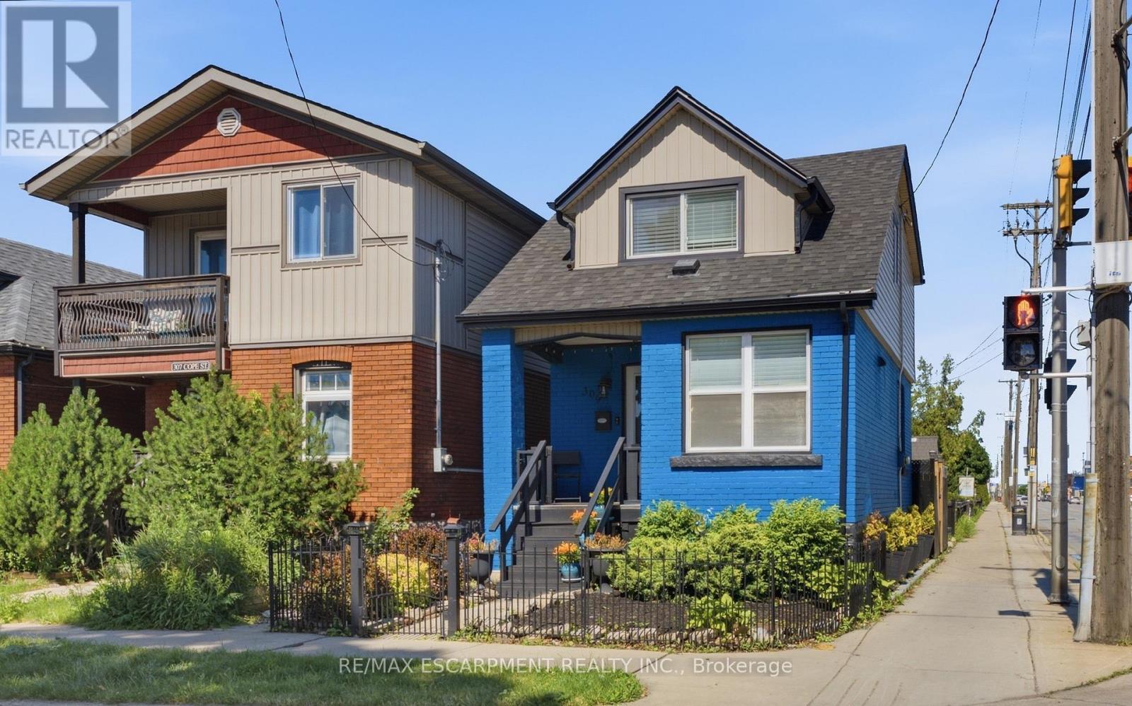 Front -Detached Home featuring a blue brick facade - 309 Cope Street, Hamilton, ON - Outdoor
