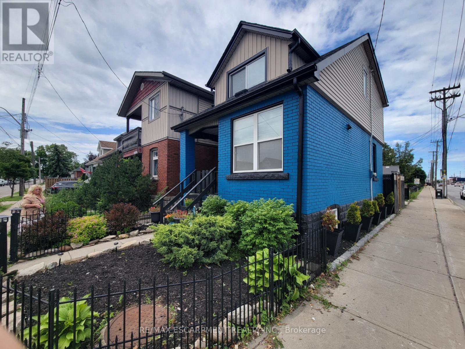 Front -Detached Home featuring a blue brick facade - 309 Cope Street, Hamilton, ON - Outdoor