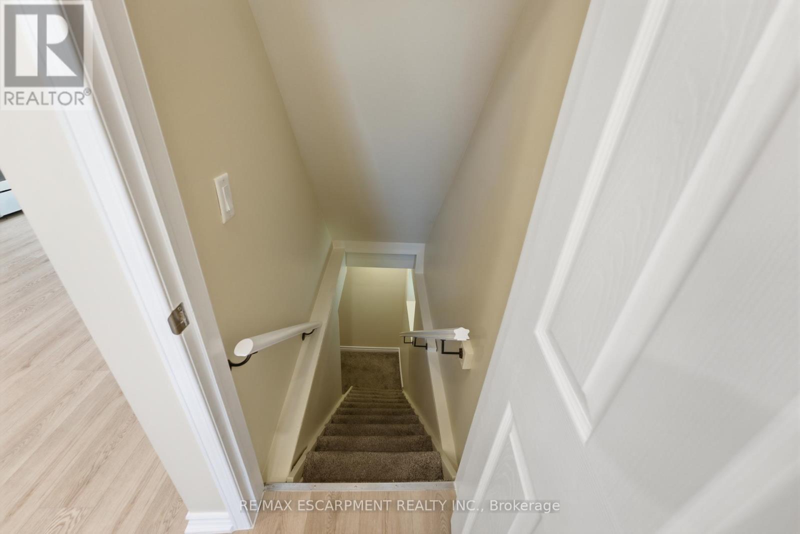 Basement Stairs off the living area - 309 Cope Street, Hamilton, ON - Indoor Photo Showing Other Room