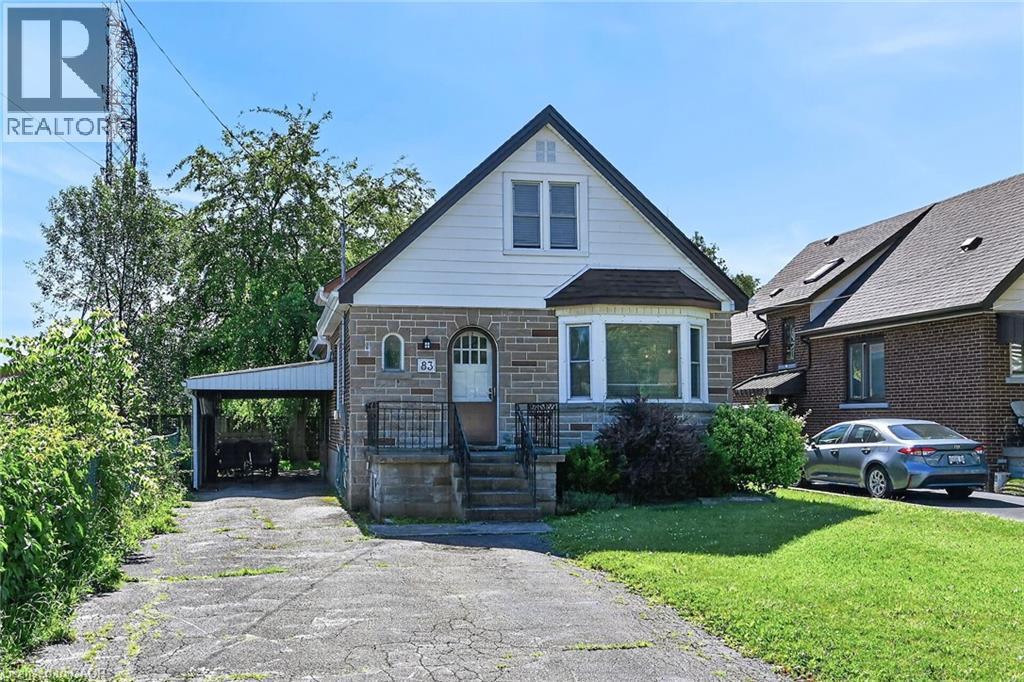 Stone and siding exterior with a prominent bay window - 83 Aberfoyle Avenue, Hamilton, ON