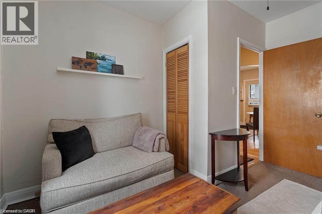 Interior room featuring light-colored walls and carpeted flooring - 2 Mill Street E, York, ON