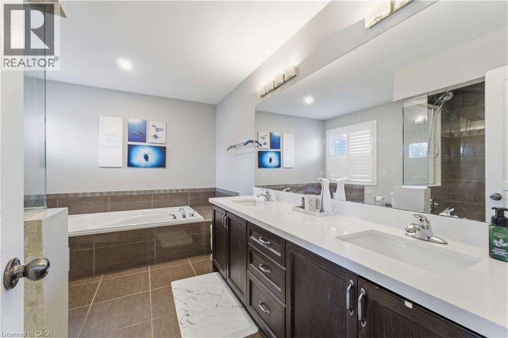 Dual vanity with undermount sinks and white countertops - 212 Chartwell Circle, Hamilton, ON