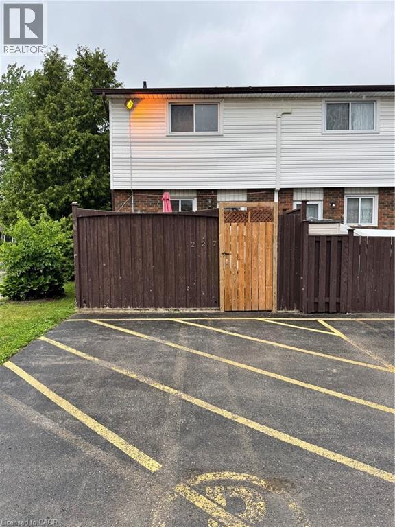 Paved parking area with yellow striped markings - 227 Fergus Avenue, Kitchener, ON