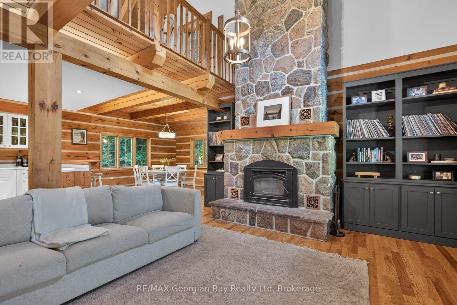 19 Kingfisher Crescent, Tiny, ON - Indoor Photo Showing Living Room With Fireplace