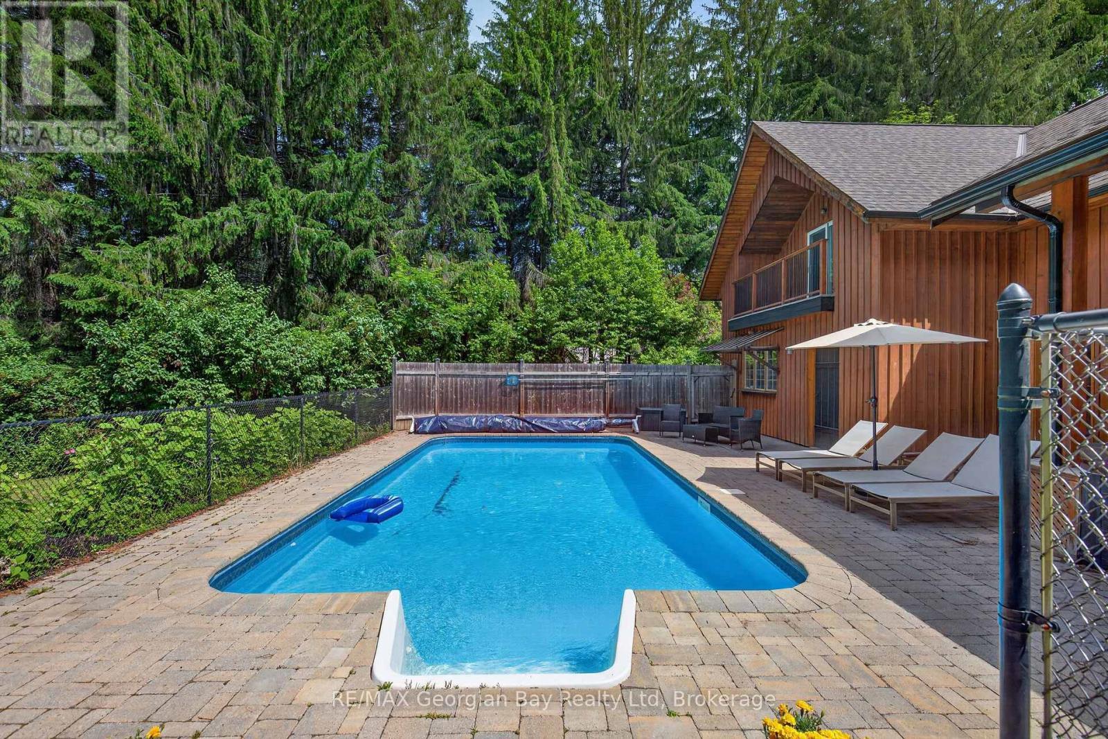 19 Kingfisher Crescent, Tiny, ON - Outdoor With In Ground Pool With Deck Patio Veranda