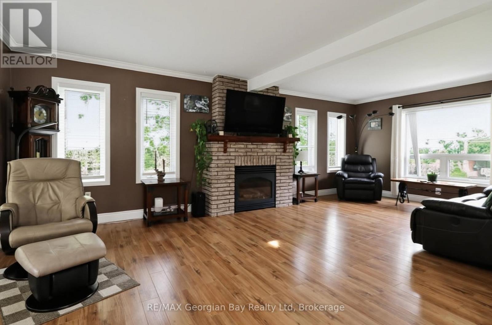 LIVING ROOM - 4 Moore Avenue, Tay, ON - Indoor Photo Showing Living Room With Fireplace
