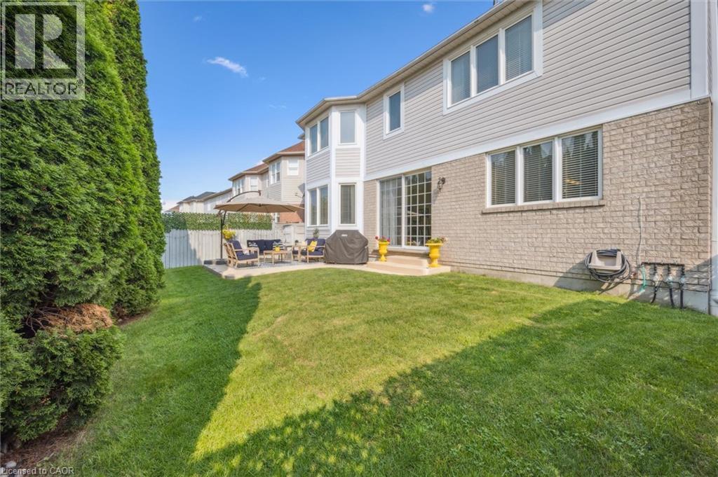 Fenced private backyard with a patio - 79 Zieman Crescent, Cambridge, ON