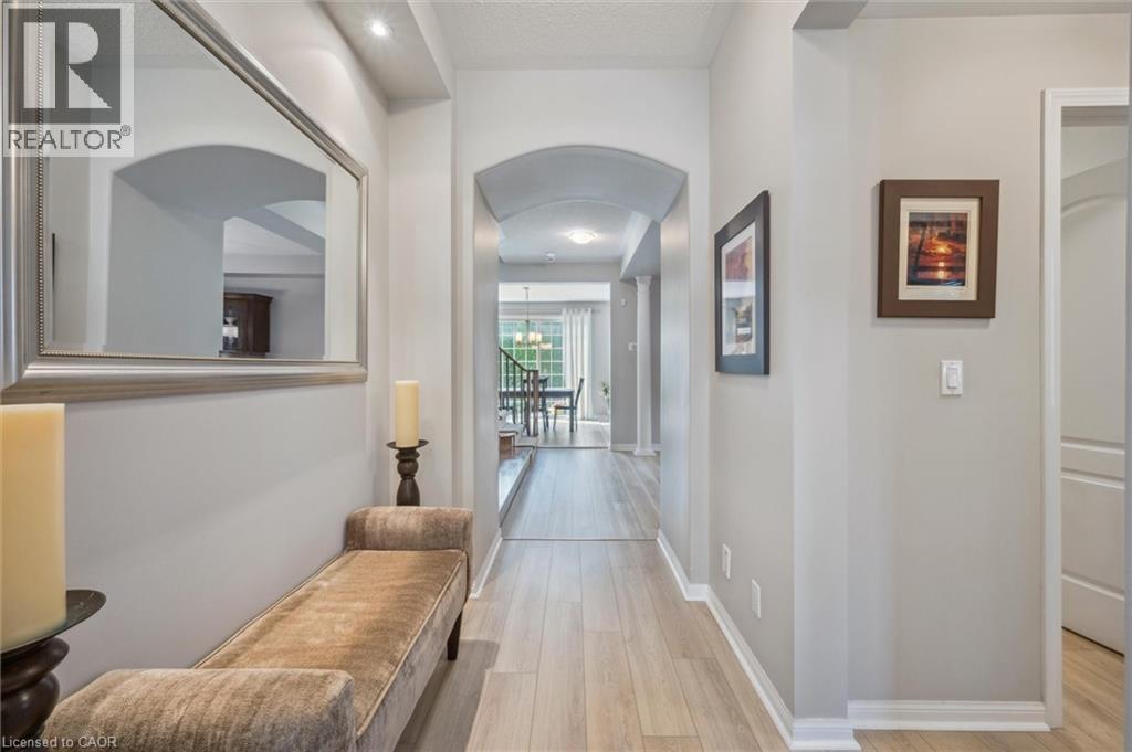 Hallway with arched walkways - 79 Zieman Crescent, Cambridge, ON