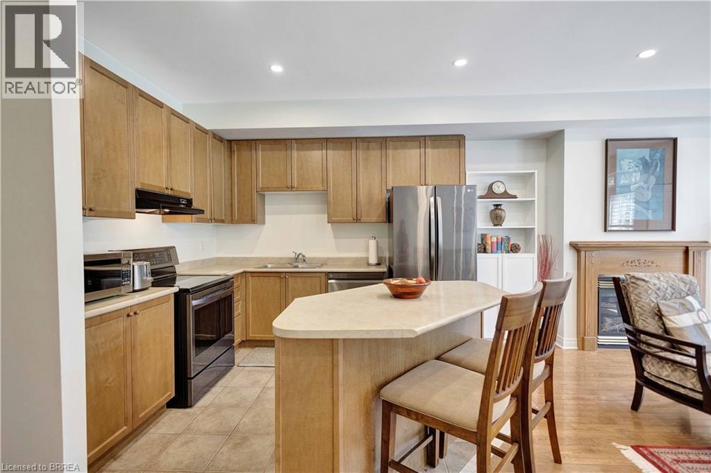 Kitchen featuring wood-finish cabinetry - 120 Beddoe Drive Unit# 6, Hamilton, ON