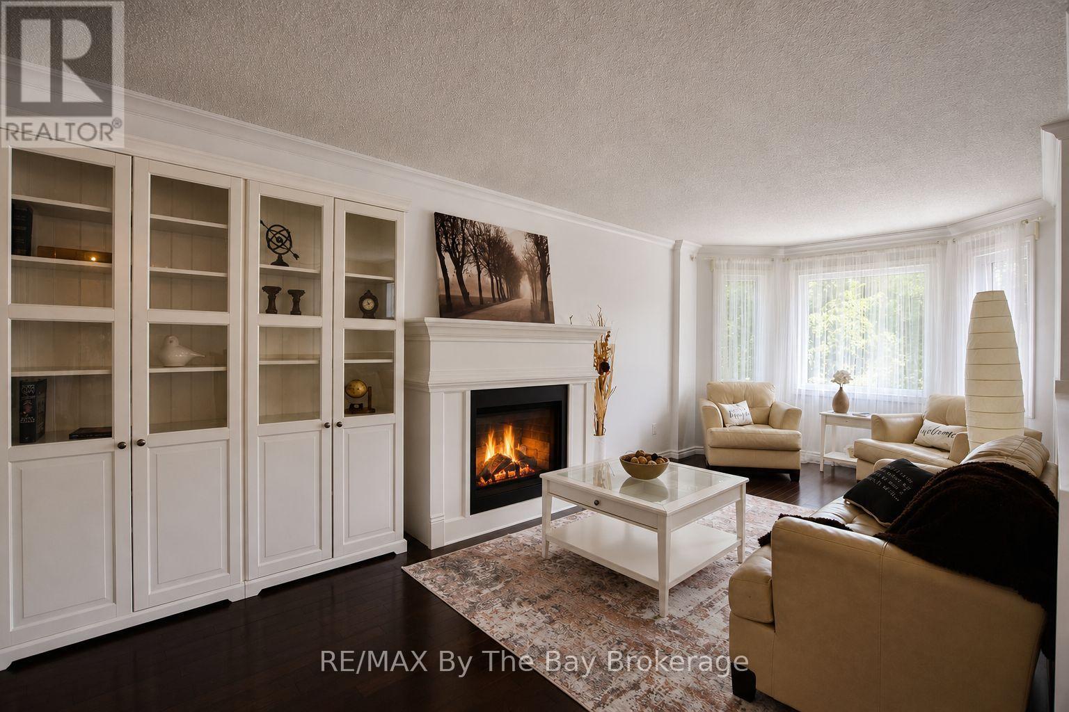 Living Area with Gas Fireplace - 2 Birchmount Circle, Wasaga Beach, ON