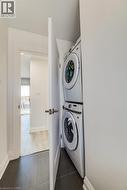 Integrated stacked washer and dryer in a dedicated utility closet -