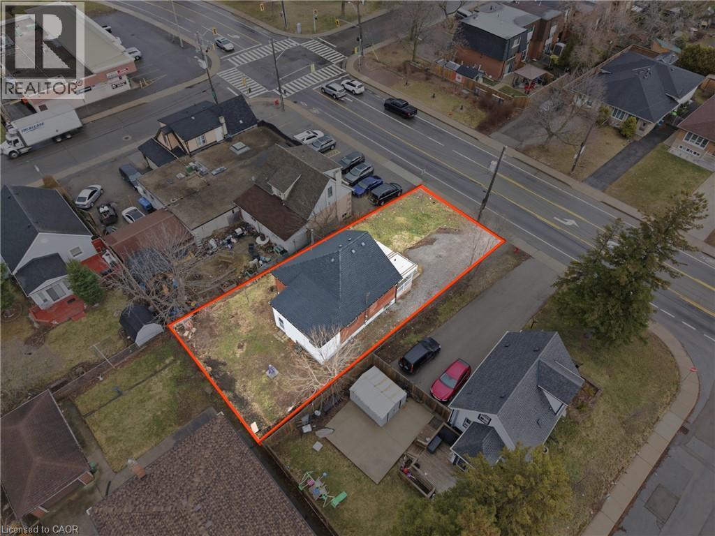 Single-story property with a dark shingle roof and brick siding - 880 Lawrence Road, Hamilton, ON