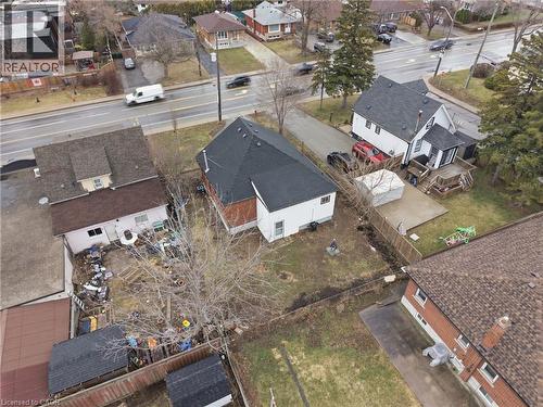 Aerial perspective showcasing a residential property with a dark shingle roof and white siding - 880 Lawrence Road, Hamilton, ON 