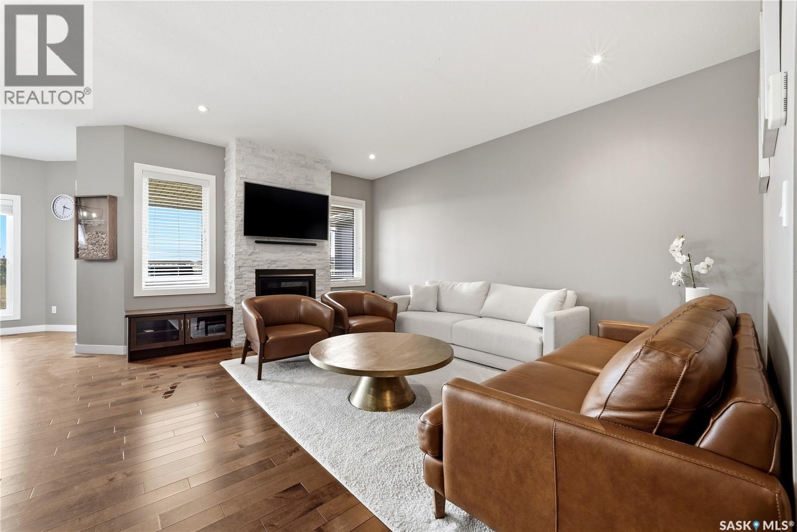3504 Green Lily Road, Regina, SK - Indoor Photo Showing Living Room With Fireplace