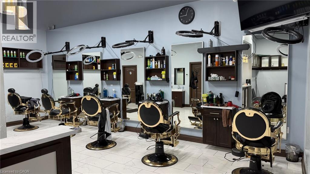 Spacious commercial interior featuring multiple styling stations with black and gold chairs - 9 Beaumaris Drive Unit# B4, Brampton, ON