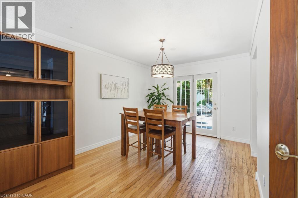 Dining area featuring wood-finish flooring and white walls - 14 Gateway Drive, Guelph, ON