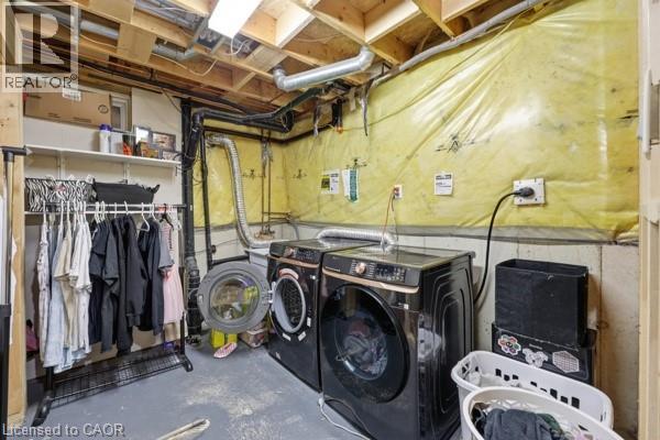 Dedicated utility space featuring exposed ceiling joists and visible ductwork - 16 Harrison Avenue, Hamilton, ON