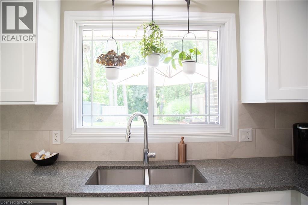 The window above the sink looks out to the backyard - 294 South Drive, Simcoe, ON