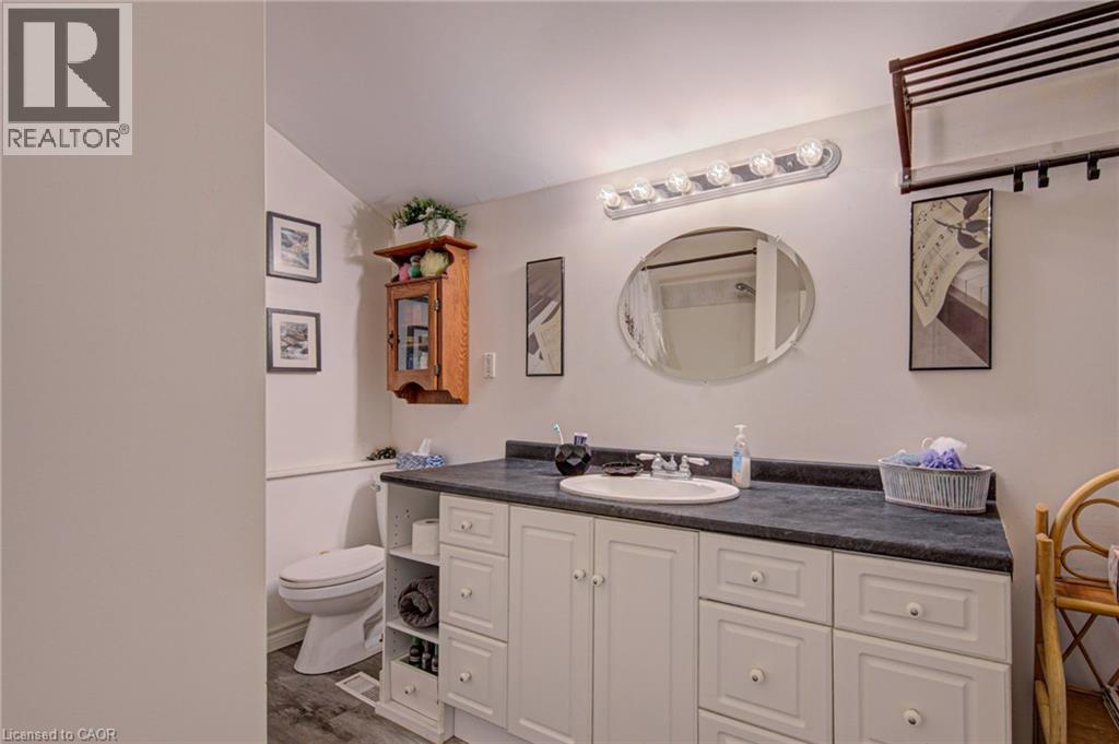 Main bath upstairs with laundry hookup - 1032 Gore Road, Hamilton, ON